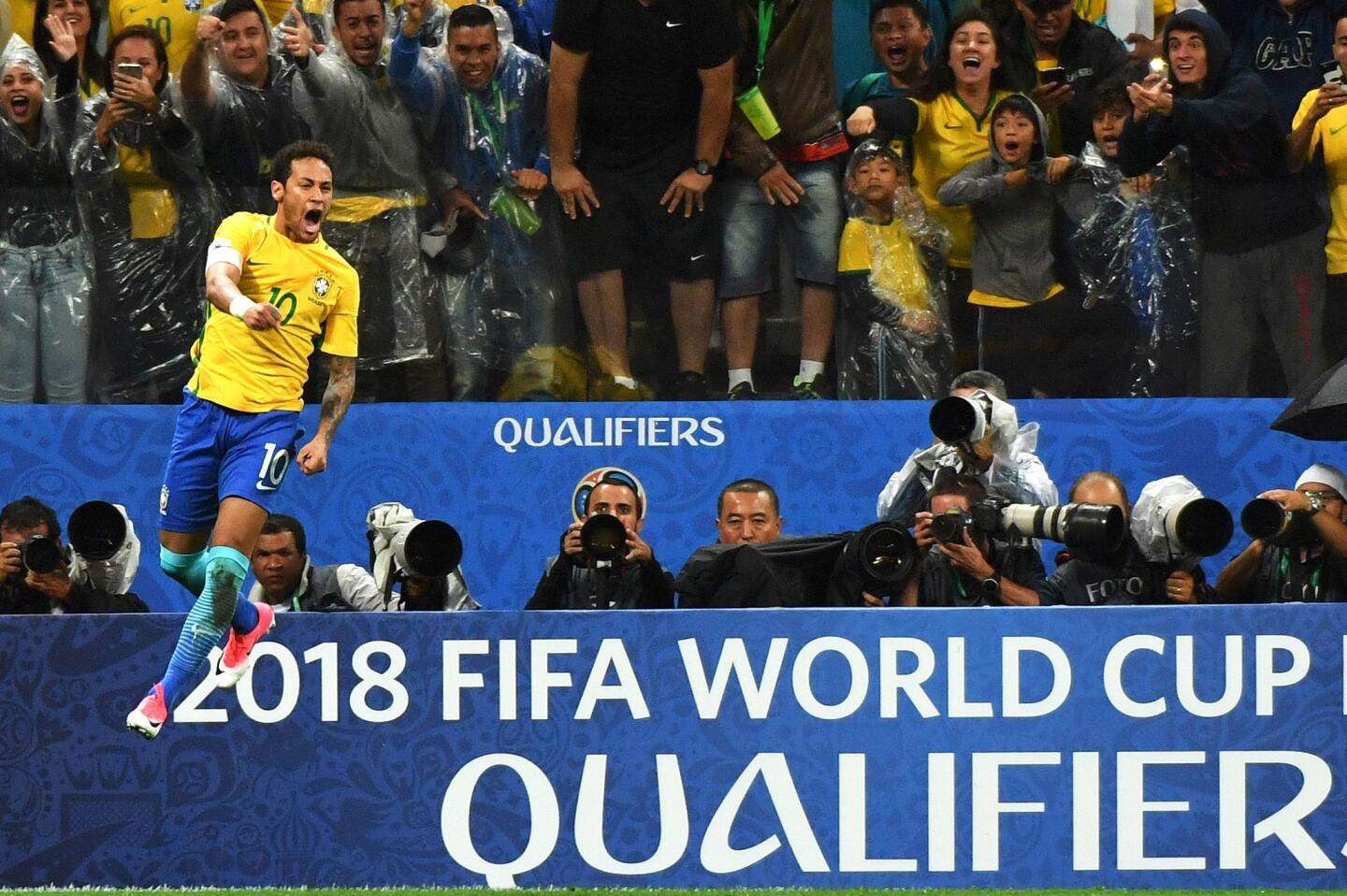 Brazil's forward Neymar celebrates after scoring against Paraguay during their 2018 FIFA World Cup qualifier football match in Sao Paulo, Brazil on March 28, 2017. / AFP PHOTO / NELSON ALMEIDANELSON ALMEIDA/AFP/Getty Images ** OUTS - ELSENT, FPG, CM - OUTS * NM, PH, VA if sourced by CT, LA or MoD **