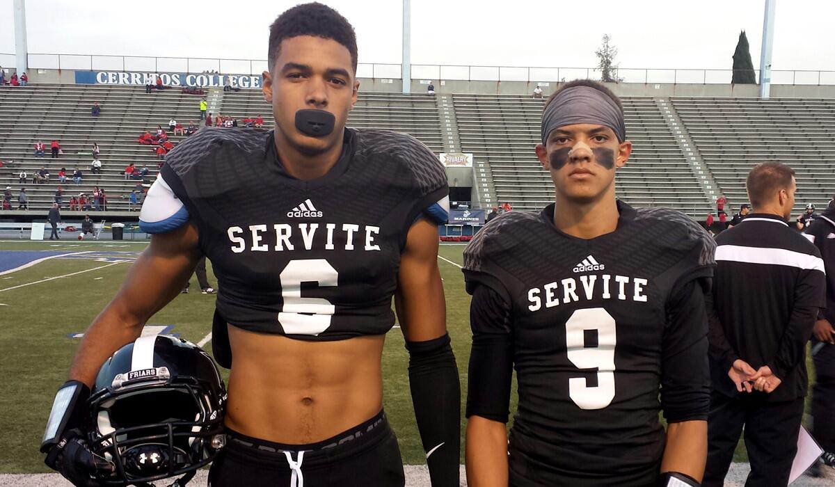 The St. Brown brothers Equanimeous (6) and Osiris (9) before their Trinity League game against Mater Dei.