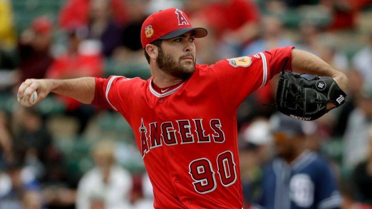 Angels pitcher Adam Hofacket works against the Padres during the second inning of a spring baseball game on Monday.