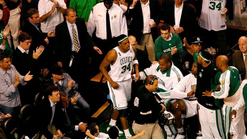 Boston's Paul Pierce returns to the court moments after being taken off in a wheelchair during Game 1 of the NBA Finals against the Lakers on June 5, 2008, at TD Garden.