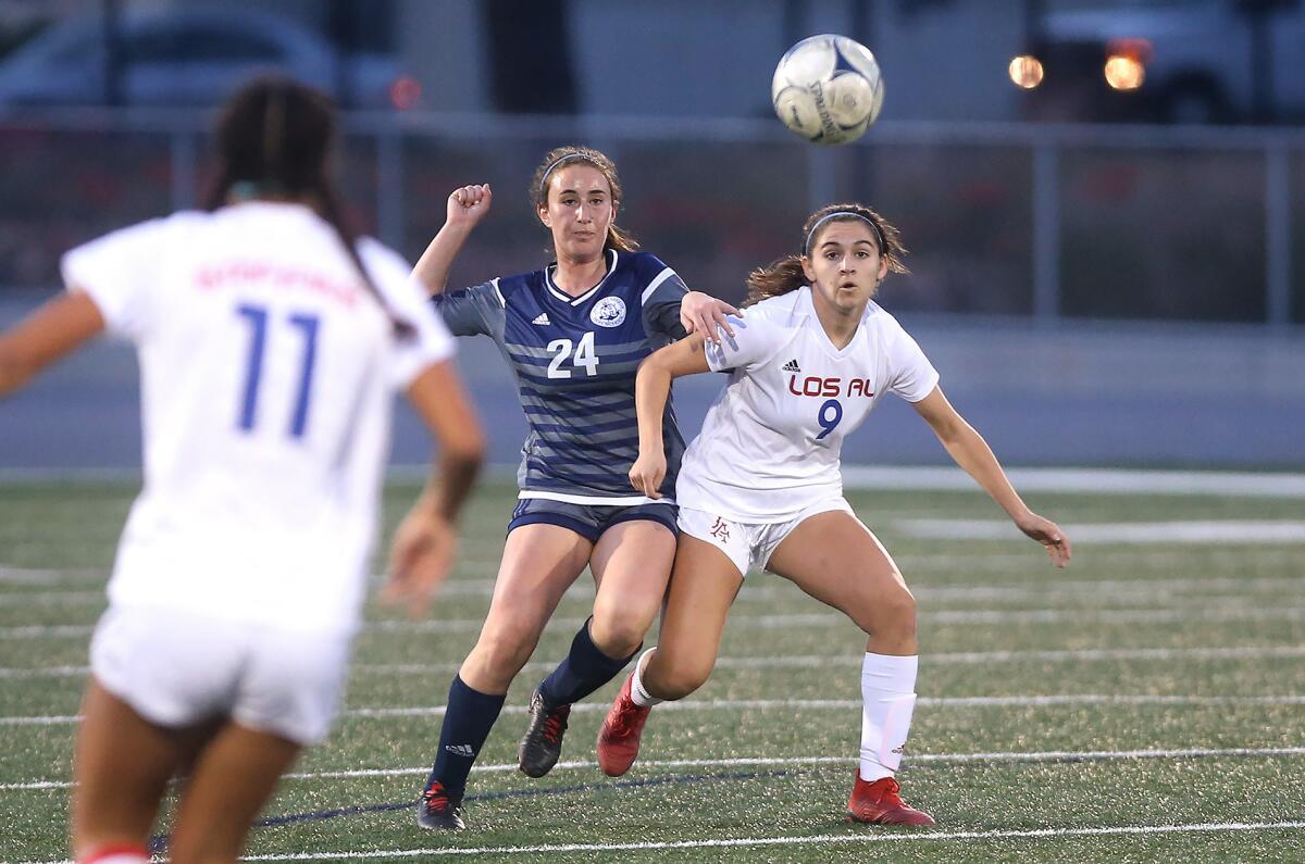 Newport Harbor's Samara Golan (24) and Los Alamitos' Tabitha LaParl (9) battle for position during the quarterfinals of the CIF Southern Section Division 1 playoffs on Feb. 12, 2019.