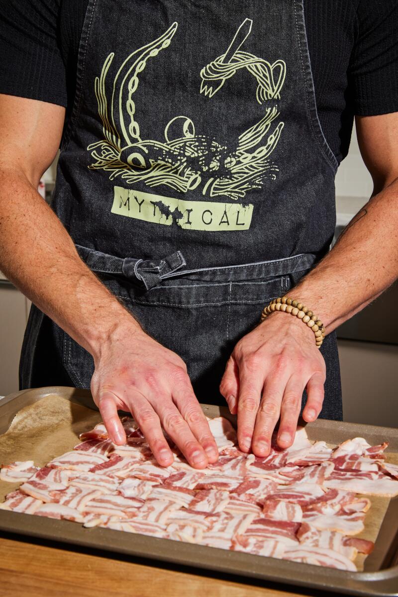 Chef Josh Scherer lattices bacon in preparation for bacon ice cream sandwiches.