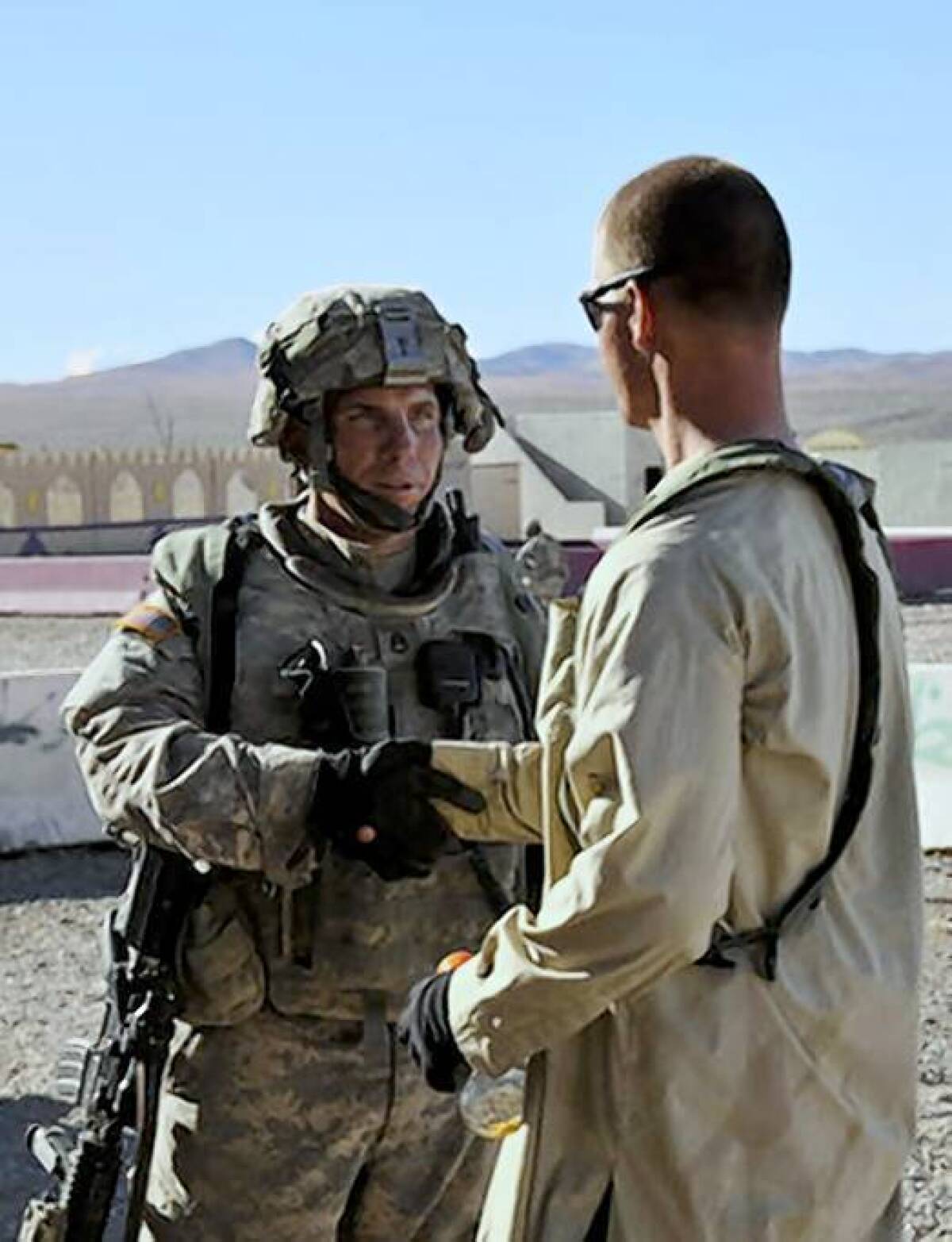 Army Staff Sgt. Robert Bales, left, is shown at Ft. Irwin in 2011.