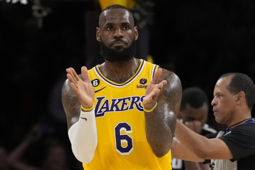 Los Angeles Lakers forward LeBron James (6) reacts after making a shot against the Sacramento Kings.