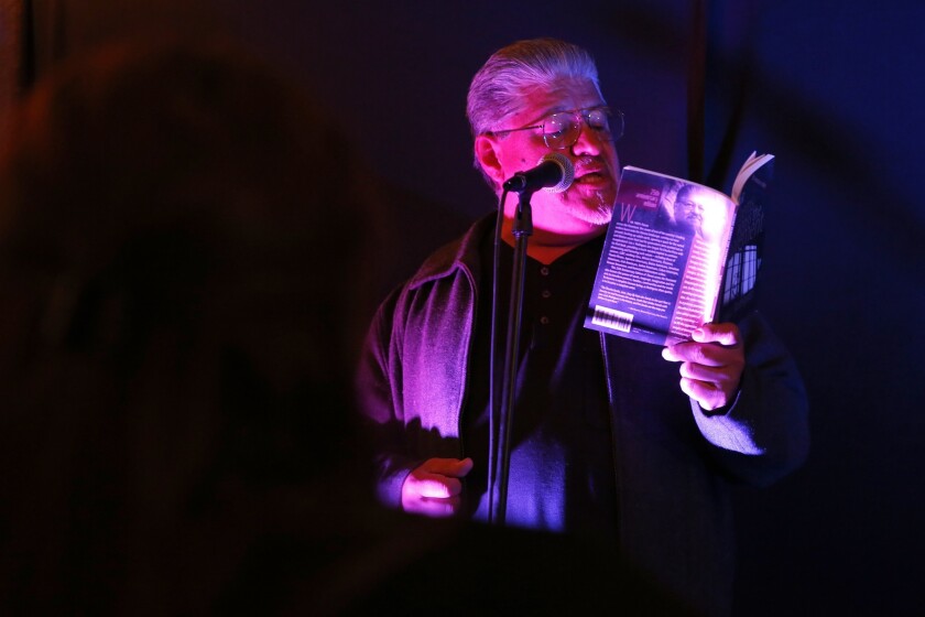 Acclaimed author, activist Luis Rodriguez reads from his book at open-mic night in the Bell garage. "I had to see it for myself," he says. "I think I've been to open mics almost everywhere, but I've never done one inside someone's garage."