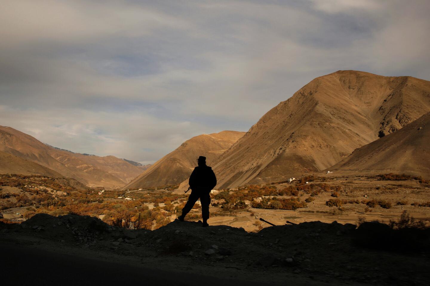 An Afghan soldier looks out over the Panjshir Valley, in the country's northeast. Panjshir is one of only two provinces never conquered by the Taliban.
