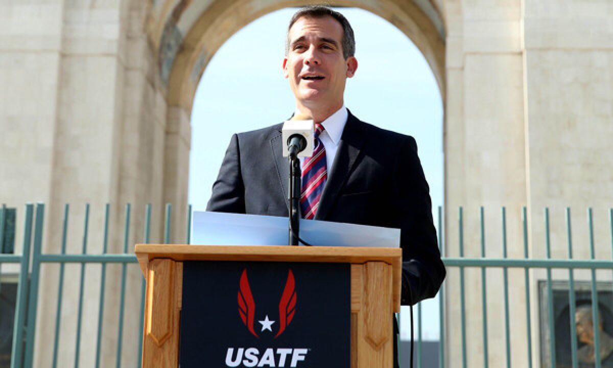 Mayor Eric Garcetti speaks at a USATF news conference at the Coliseum on Wednesday to announce Los Angeles as the host city for the 2016 U.S. Olympic marathon trials.