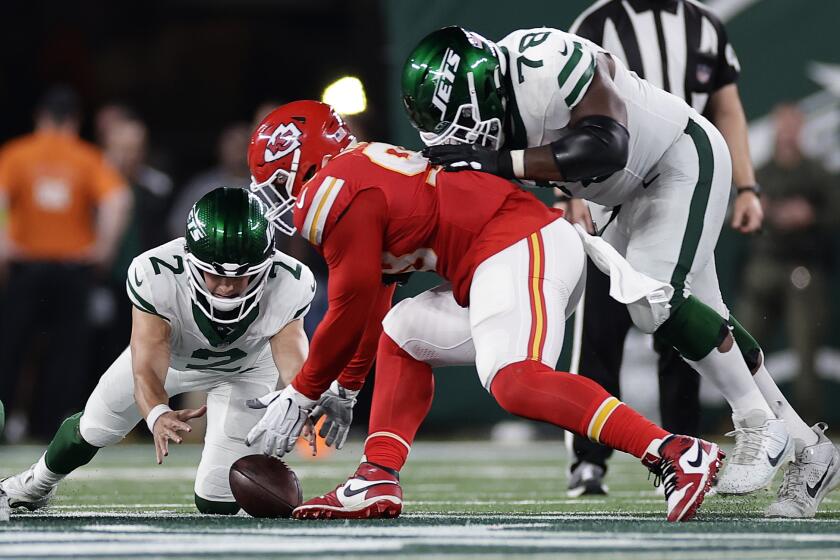 New York Jets quarterback Zach Wilson (2) fumbles the ball to turn the ball over to the Kansas City Chiefs during the fourth quarter of an NFL football game, Sunday, Oct. 1, 2023, in East Rutherford, N.J. (AP Photo/Adam Hunger)