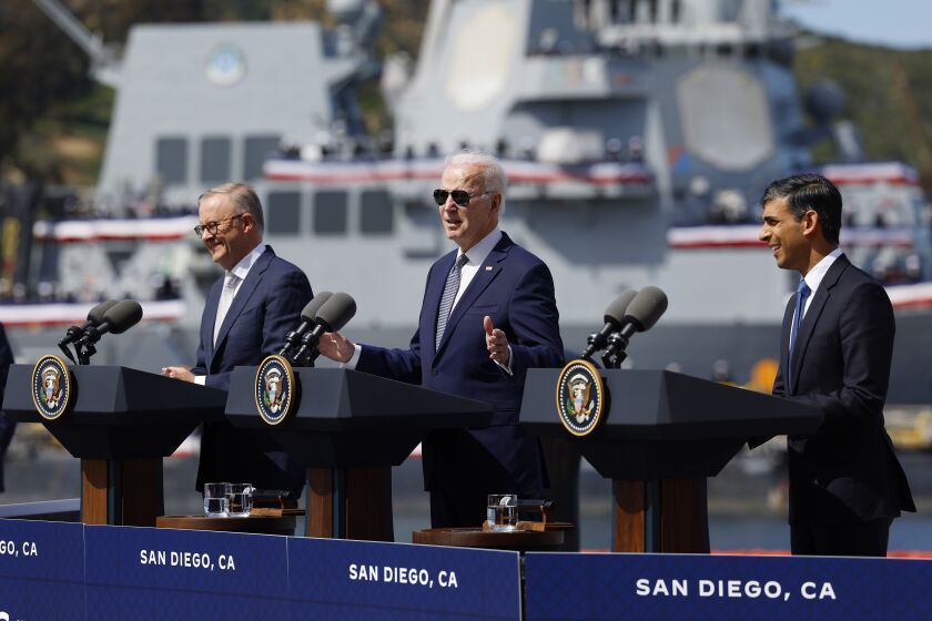 San Diego, CA - March 13: President Joe Biden, center, talks about a new AUKUS partnership with Australian Prime Minister Anthony Albanese, left, and with British Prime Minister Rishi Sunak at Naval Base Point Loma on Monday, March 13, 2023. (K.C. Alfred / The San Diego Union-Tribune)