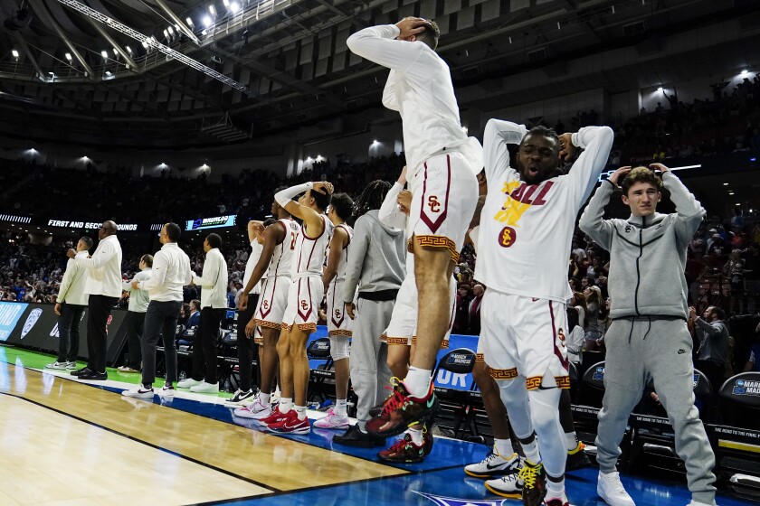 The USC bench reacts immediately after losing to Miami in the first round of the NCAA tournament on Friday.