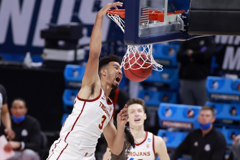 INDIANAPOLIS, INDIANA - MARCH 20: Isaiah Mobley #3 of the USC Trojans dunks the ball in the game against the Drake Bulldogs.
