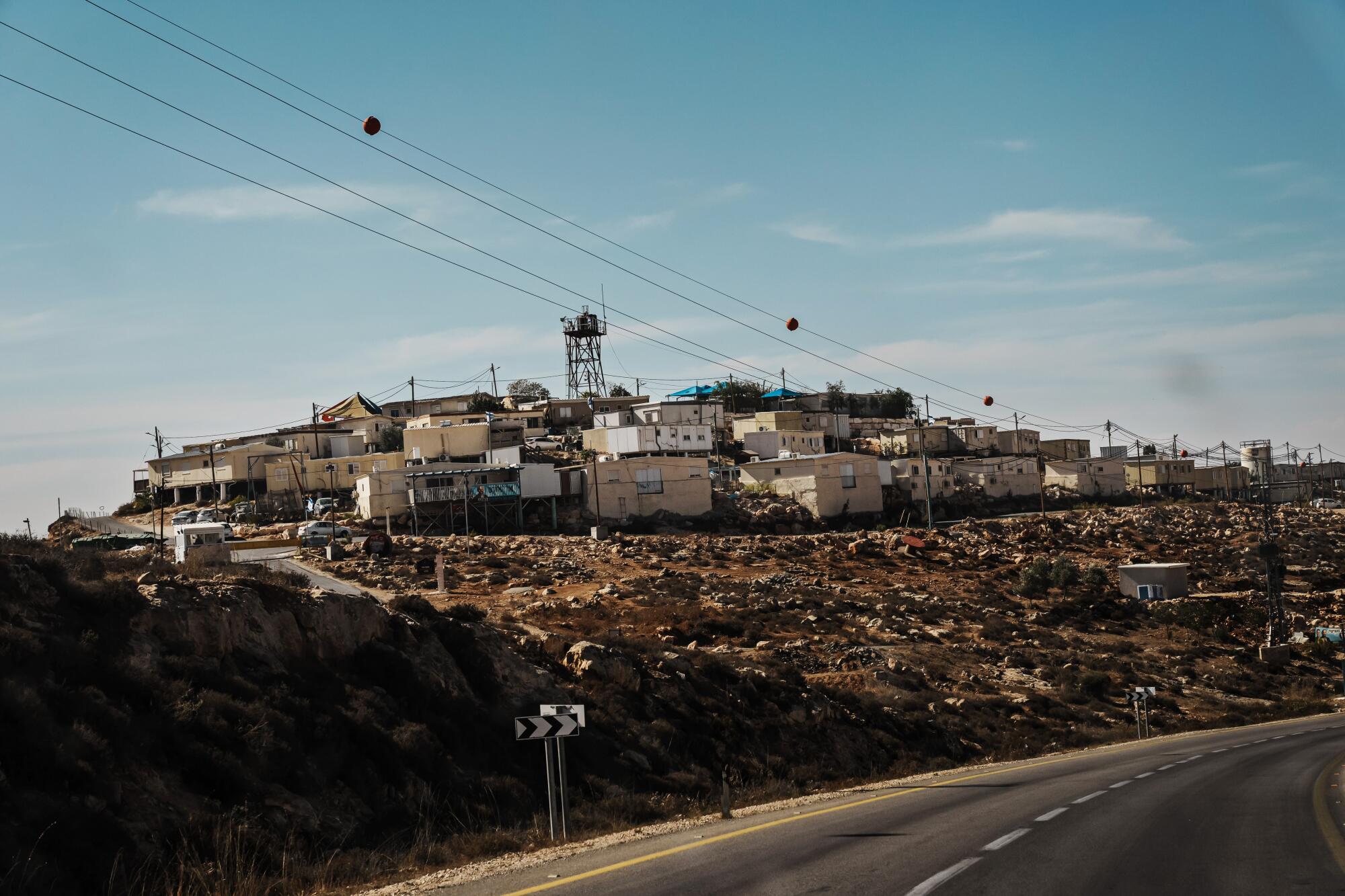 A view of an elevated cluster of buildings near a road 