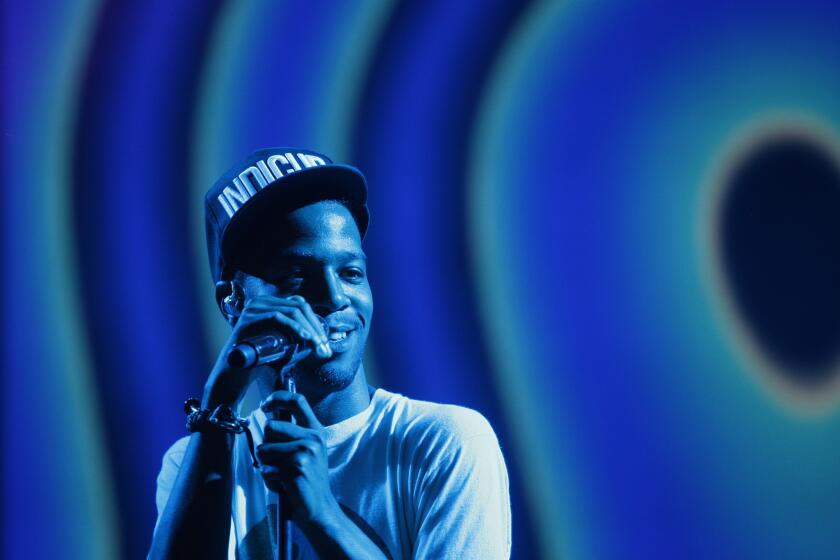 Kid Cudi performs at the Rock the Bells festival in San Bernardino in 2012. On Tuesday, the artist announced he is seeking treatment for depression.