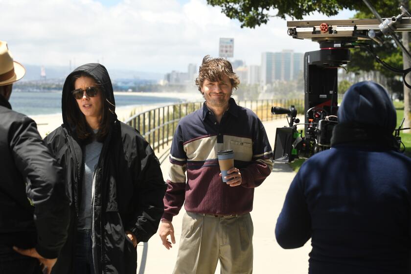 Wyatt Russell, center, as slacker protagonist Sean "Dud" Dudley on break during filming of AMC's Long Beach-set of "Lodge 49."