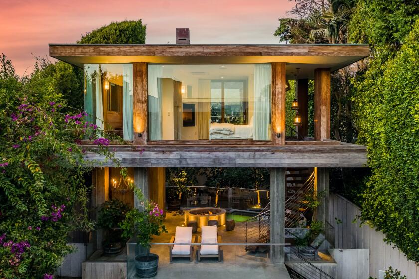 Overlooking Malibu Lagoon, the mini compound holds a 5,500-square-foot main house, one-bedroom guesthouse and sun deck with a swimming pool.