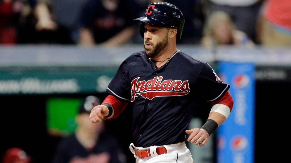 Cleveland Indians' Jason Kipnis scores on a two-run triple hit by Francisco Lindor in the sixth inning against the Detroit Tigers on Friday.