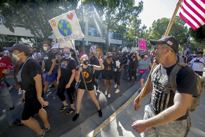 A BLM protesters argues with a Trump supporter during a BLM protest in La Mesa Saturday, 08/01/2020. photo by Bill Wechter