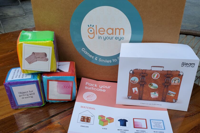 The 'Pack Your Suitcase' game inside the first Gleam in Your Eye box, filled with activities for those with dementia
