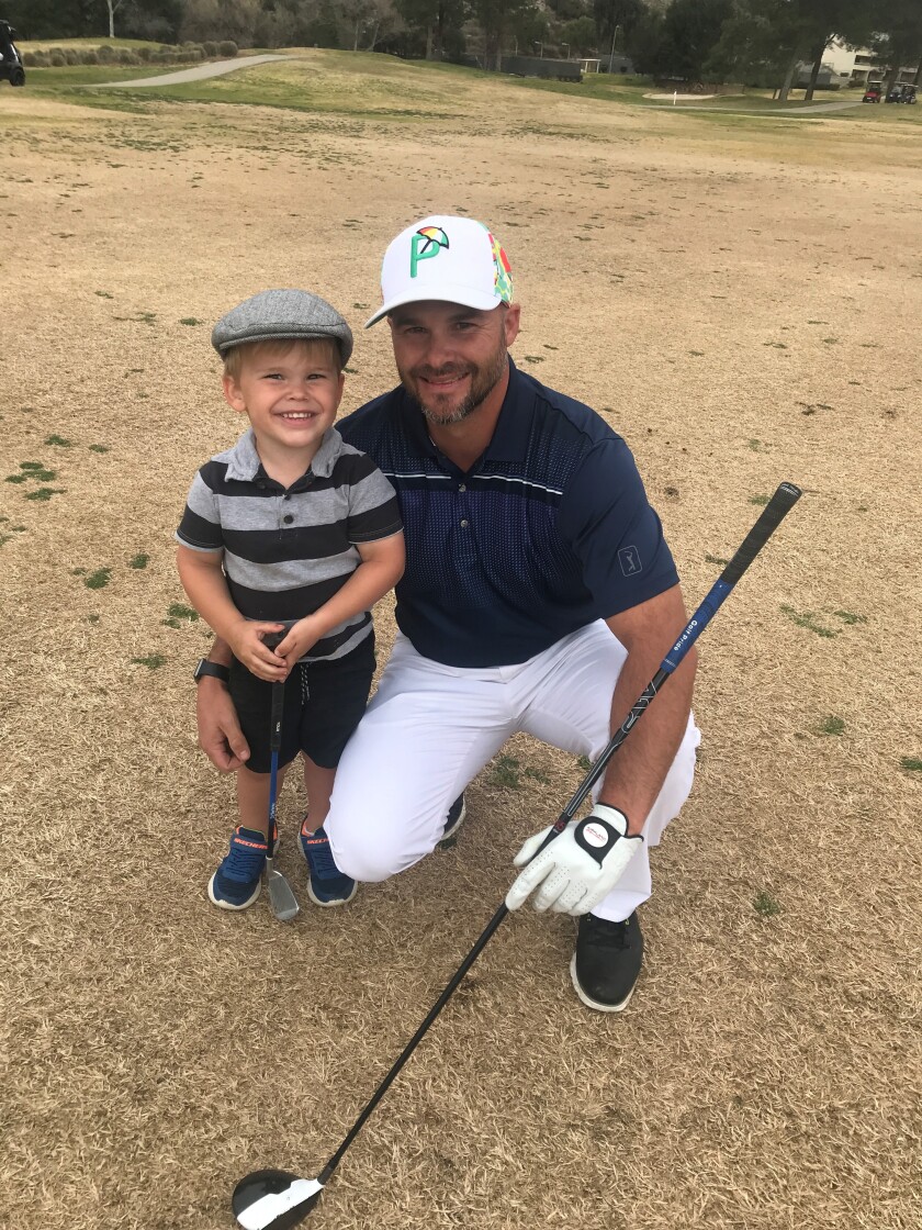 Josh Dollick and son Cade, 3, at the renovated San Vicente golf course on Sunday, Jan. 31.