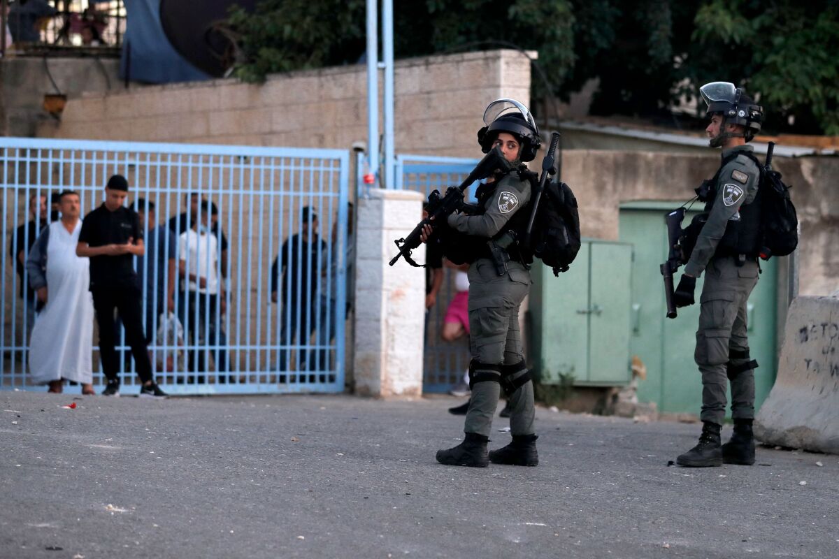 Israeli border guards stand at attention in the east Jerusalem neighborhood of Sheikh Jarrah.