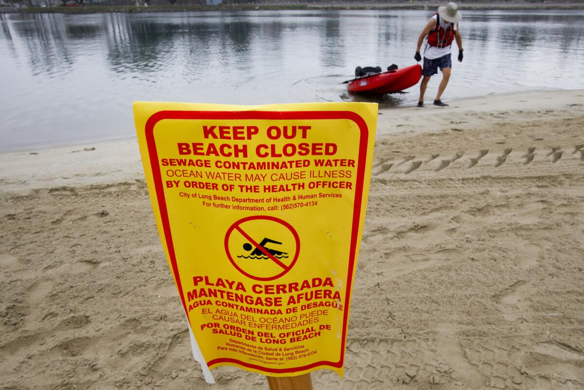 A spill from a private sewer system led officials to close Mothers' Beach on Alamitos Bay in October 2012, though not all visitors heeded posted warnings.