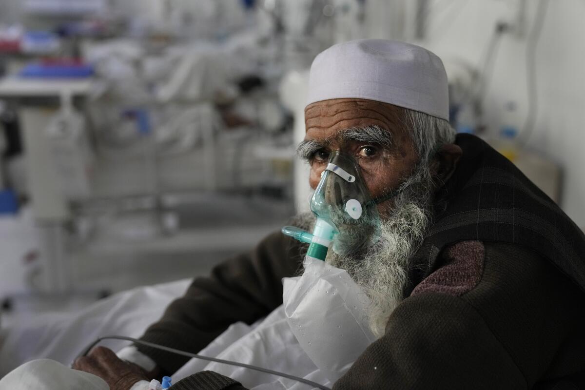 Afghan COVID-19 patient using oxygen mask