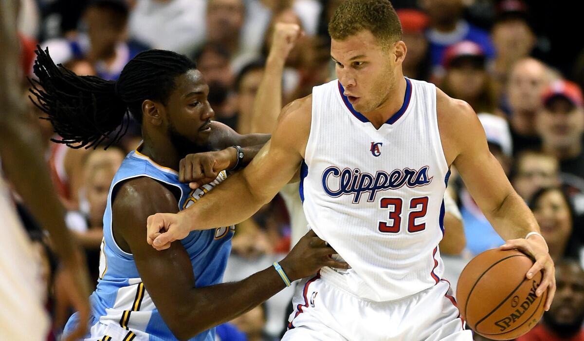 Clippers power forward Blake Griffin works in the post against Nuggets power forward Kenneth Faried on Saturday night.