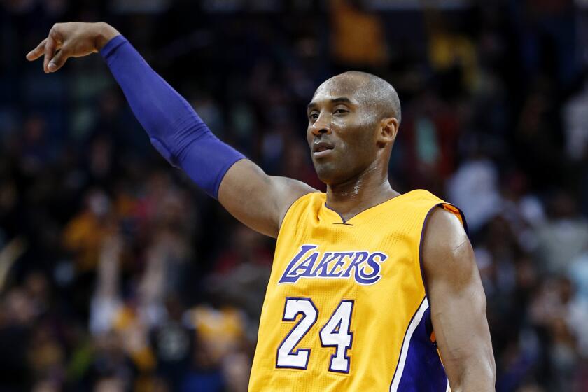 Los Angeles Lakers forward Kobe Bryant reacts after sinking a 3-point shot late in the second half against the New Orleans Pelicans on Thursday.