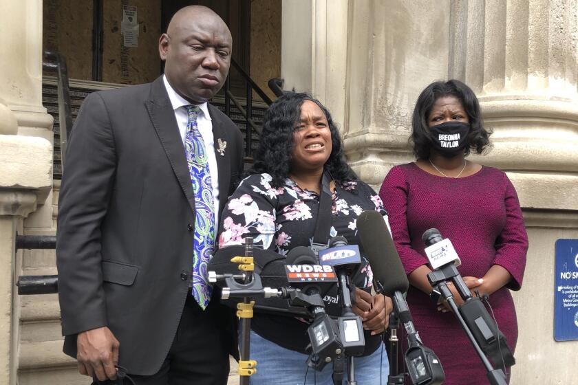 Tamika Palmer, mother of Breonna Taylor, addresses the media in Louisville, Ky. on Thursday, Aug. 13, 2020. Five months after her daughter was shot to death by police, Palmer said she is trying to be patient while waiting to hear if the officers will be charged. (AP Photo/Dylan Lovan)