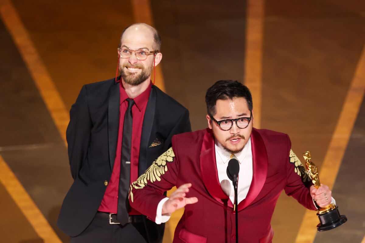 Two men accept Oscars onstage