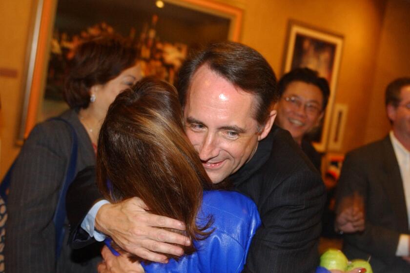Christine Cotter –– – State Senator Joe Dunn greets supporters in the lobby outside of the Marina Ballroom at the Disneyland Hotel. Disneyland Hotel on election night 11–5–02.