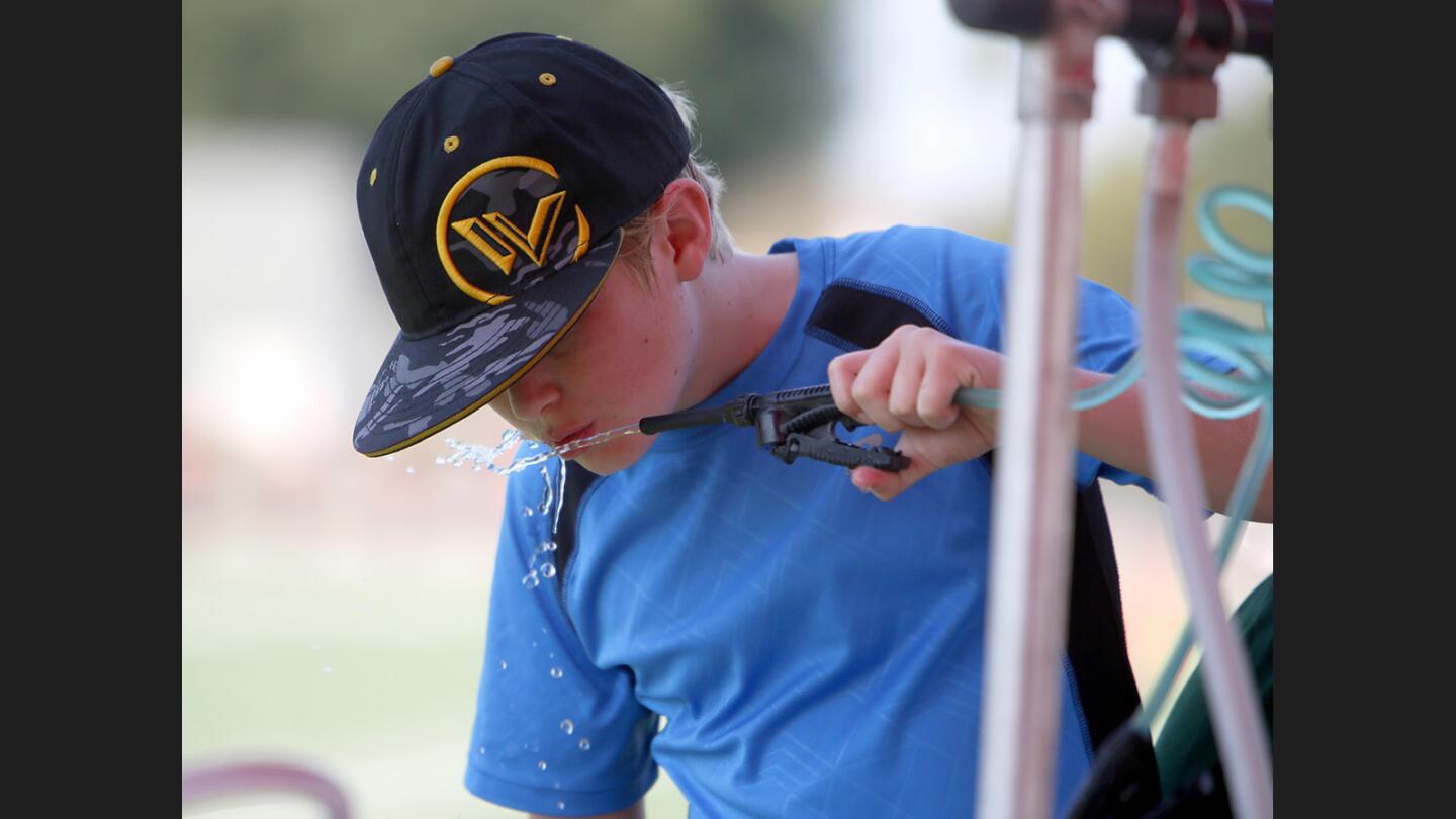 Photo Gallery: Football camp at Burroughs High School for six- to thirteen-year olds