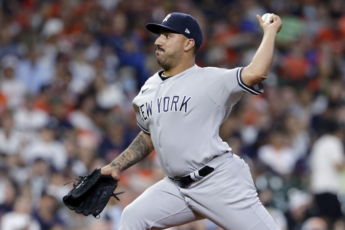 New York Yankees starting pitcher Nestor Cortes throws to a Houston Astros batter during the first inning of a baseball game Friday, July 9, 2021, in Houston. (AP Photo/Michael Wyke)