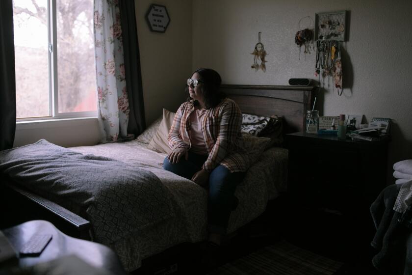 SAN MIGUEL, CA - DECEMBER 16: Mel Ruth Gonzalez, a senior at Paso Robles High School, looks out the window of her bedroom on Thursday, Dec. 16, 2021 in San Miguel, CA. "My family and myself have integrated into this culture," says Gonzalez, who was born in the U.S. to parents who immigrated from Mexico. "It would be nice for them to recognize our culture. Why wouldn't you want to? There's so many of us here." (Jason Armond / Los Angeles Times)