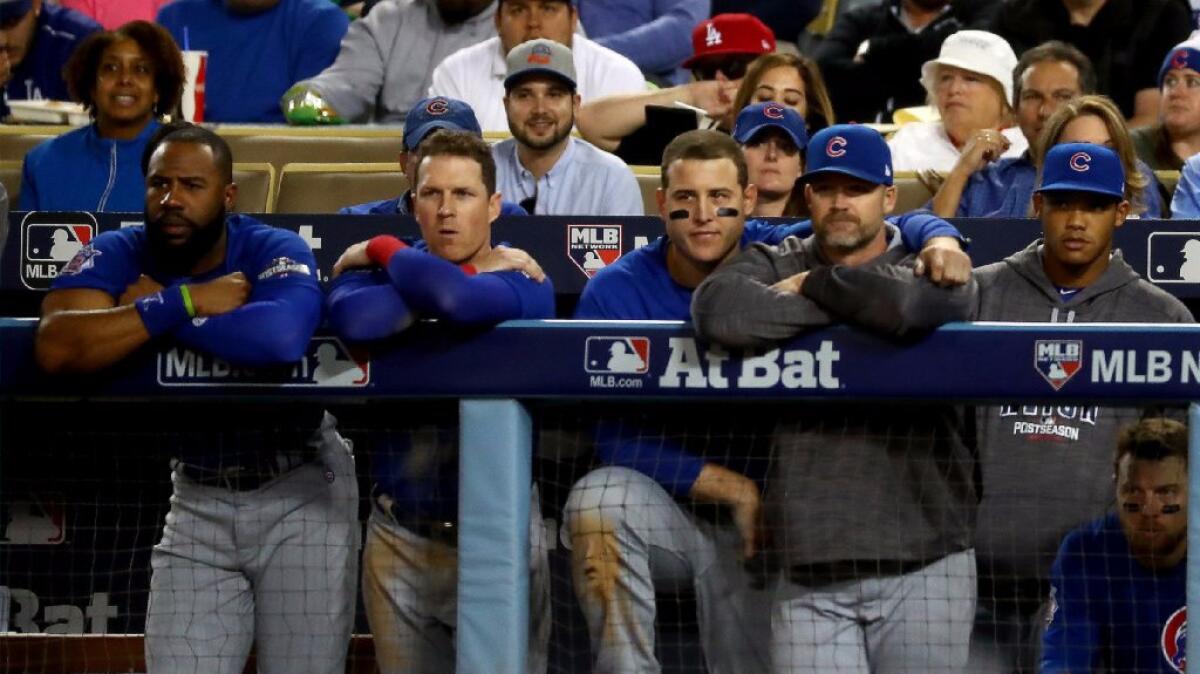 Cubs players look on from the dugout during a 6-0 loss to the Dodgers in Game 3 of the NLCS at Dodger Stadium on Oct. 18.