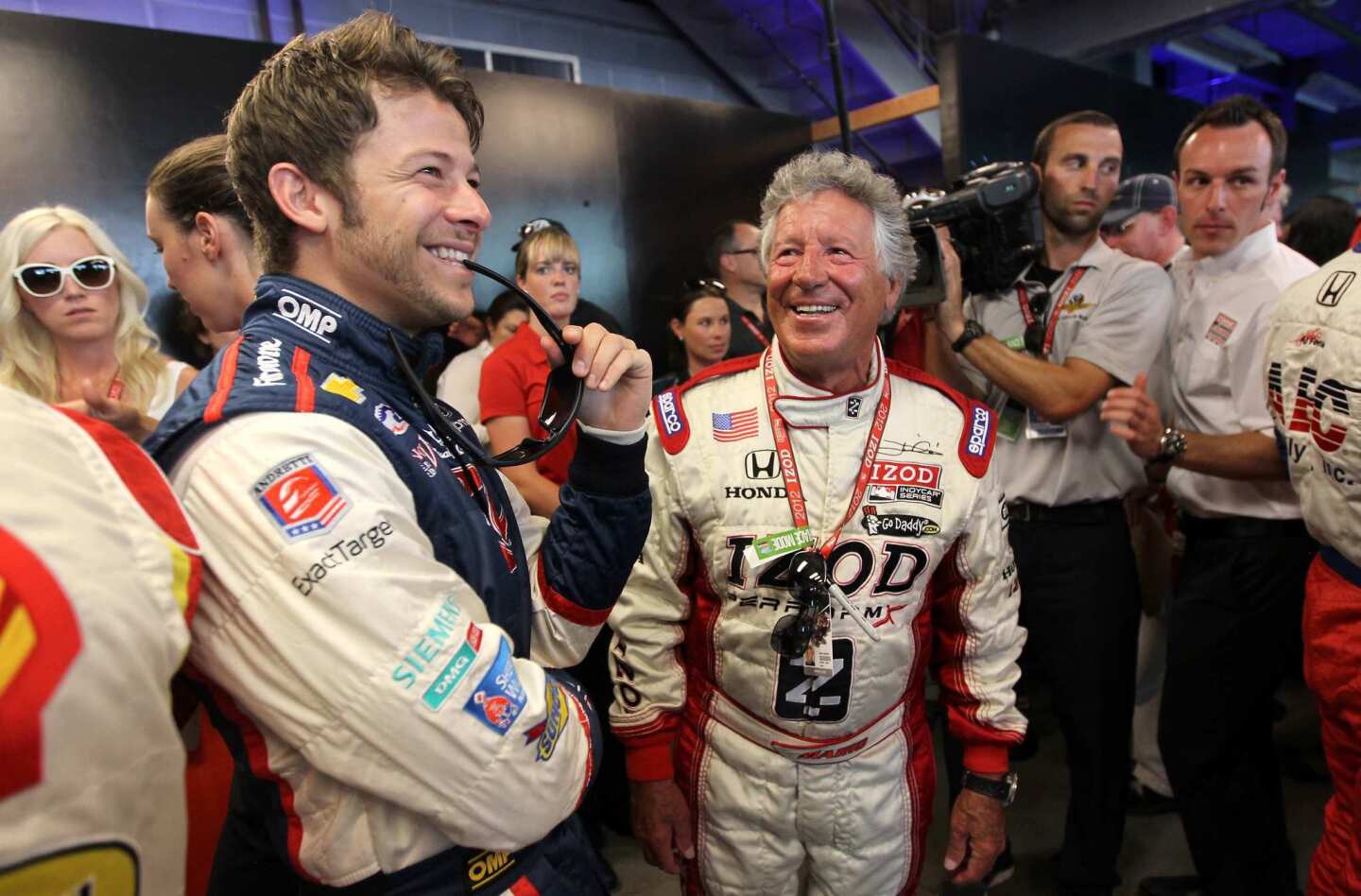 IndyCar driver Marco Andretti, left, shares a laugh before the race Sunday with his grandfather, Mario Andretti, the 1969 Indy 500 winner.