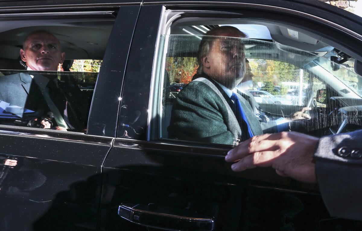 Republican presidential candidate Donald Trump looks out from his car window as he leaves after speaking at a town hall meeting at the Atkinson Country Club in Atkinson, N.H., Monday, Oct. 26, 2015. (AP Photo/Cheryl Senter)