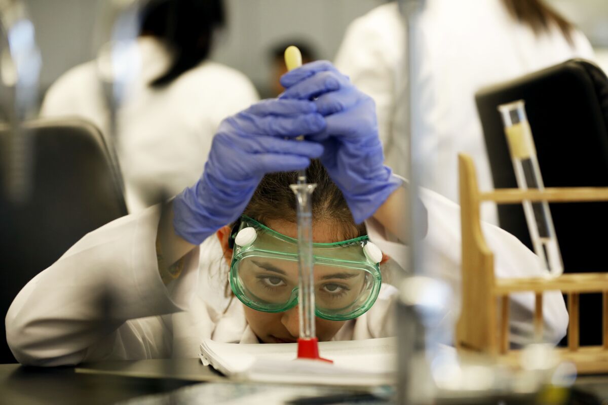 Mia Turel, a 13-year-old Cal State L.A. student, during a chemistry lab on campus.