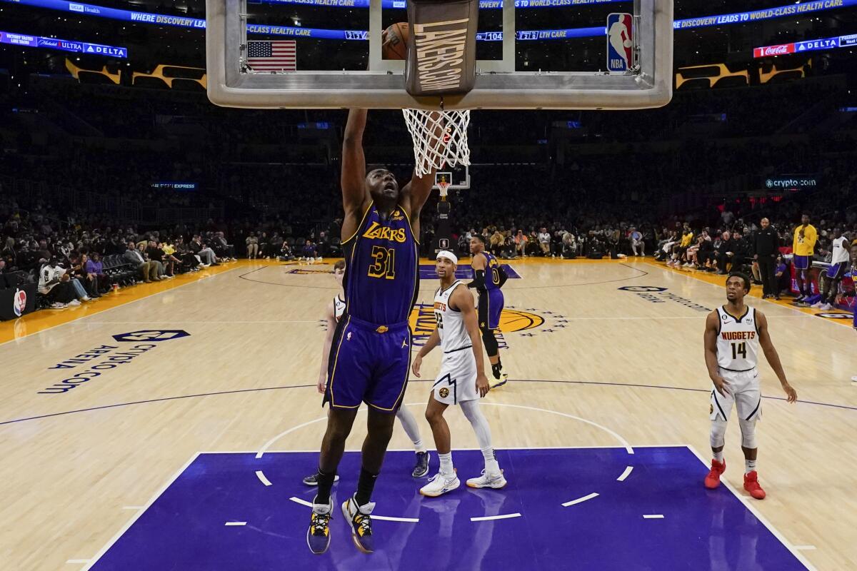 Lakers center Thomas Bryant dunks during a game against the Denver Nuggets 