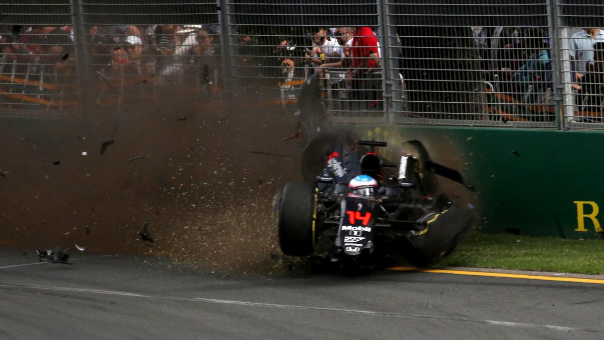 The car of Formula One driver Fernando Alonso crashes into the wall after colliding with the car of Esteban Gutierrez during the Australian Grand Prix on Sunday.