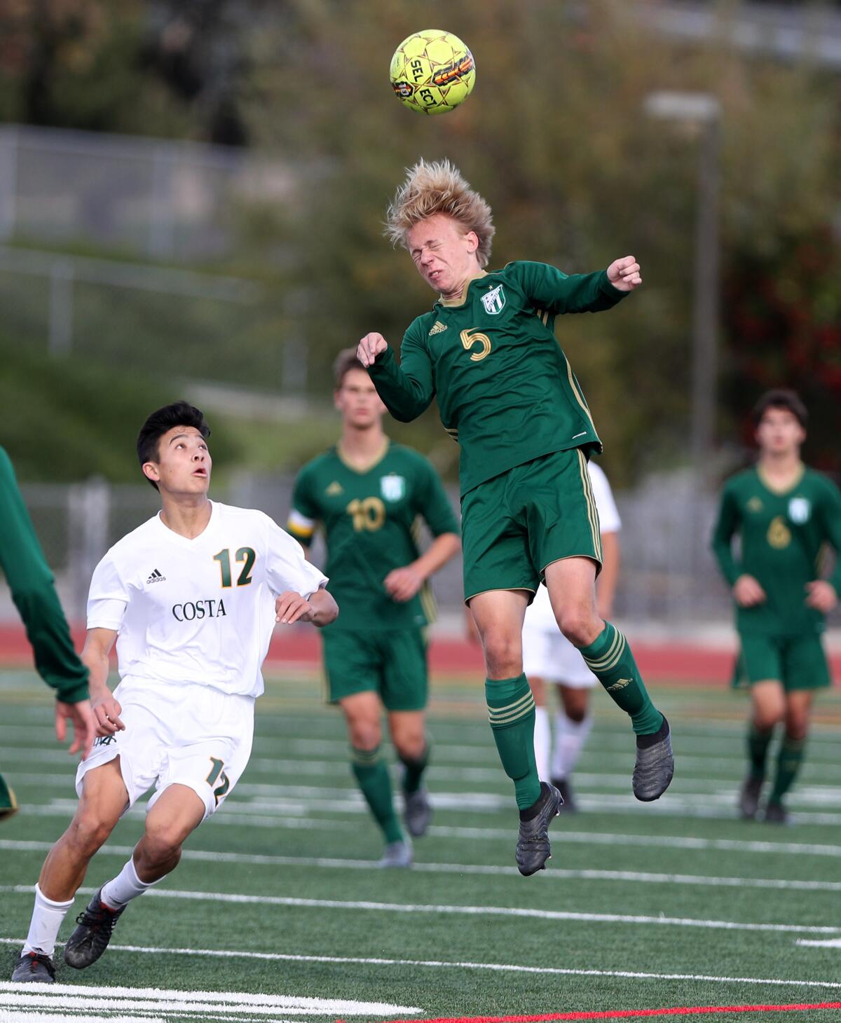 Edison's Marcus Henze goes up for a header in the Laguna Hills Hawks Invitational title match against Mira Costa on Dec. 28, 2019.