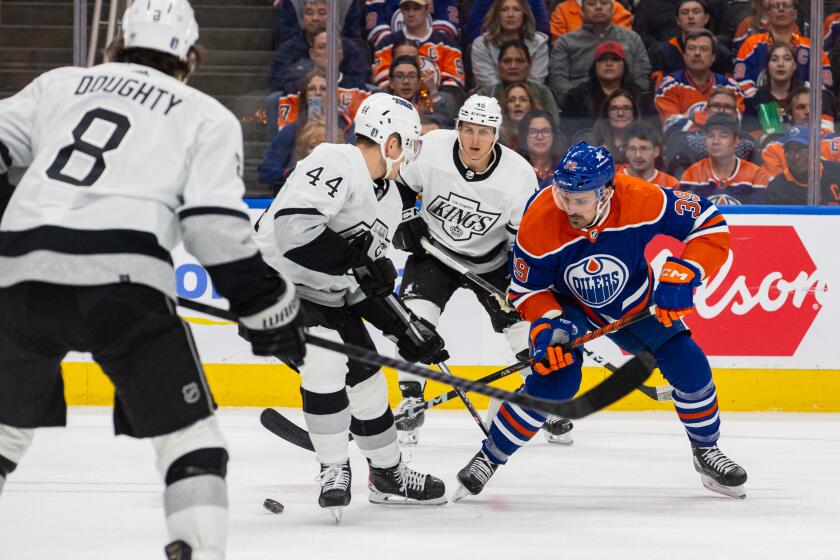 EDMONTON, AB - APRIL 24: Los Angeles Kings Defenceman Mikey Anderson (44) checks Edmonton Oilers Center Sam Carrick (39) in the first period of game two of the Western Conference First Round Edmonton Oilers game versus the Los Angeles Kings on April 24, 2024 at Rogers Place in Edmonton, AB. (Photo by Curtis Comeau/Icon Sportswire via Getty Images)