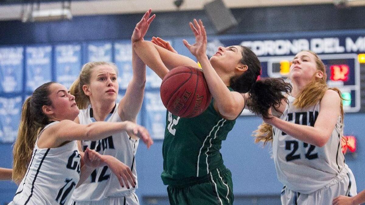 Sophie Beador (12) and Tatiana Bruening (22) played big roles as CdM collected its third straight win in the SoCal Holiday Prep Classic on Saturday.