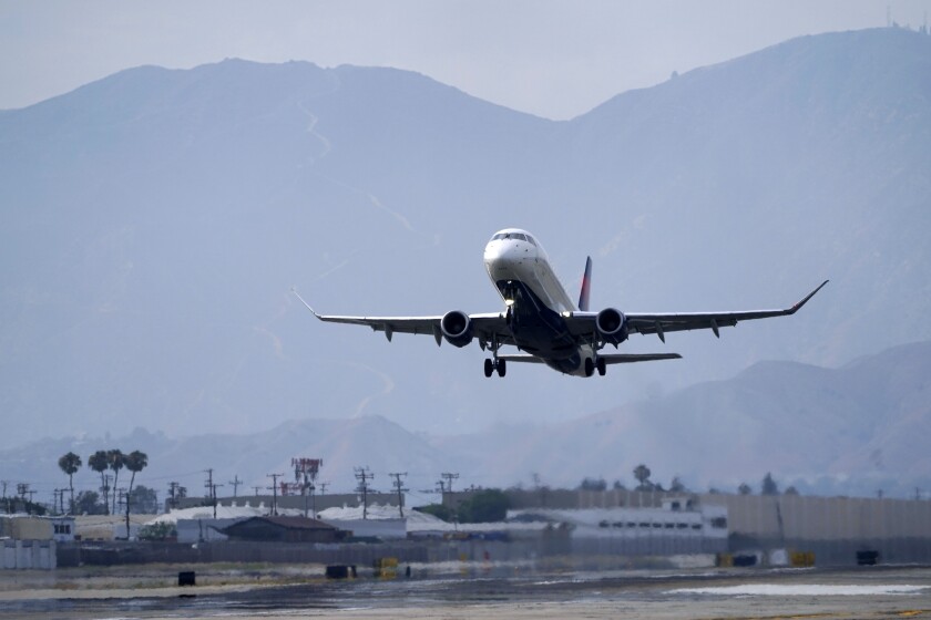 A Delta Air Lines jet takes off from Hollywood Burbank Airport Thursday, July 8, 2021, in Burbank, Calif. Airlines are adding more flights as the number of travelers continues to rise. The airlines are expecting the recovery to mean more traffic this winter. (AP Photo/Mark J. Terrill)