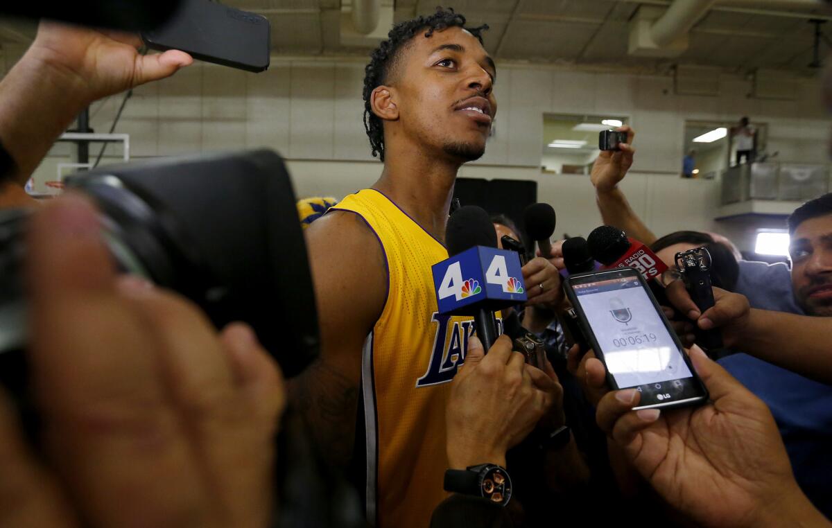 Lakers guard Nick Young talks to reporters during the team's media day.