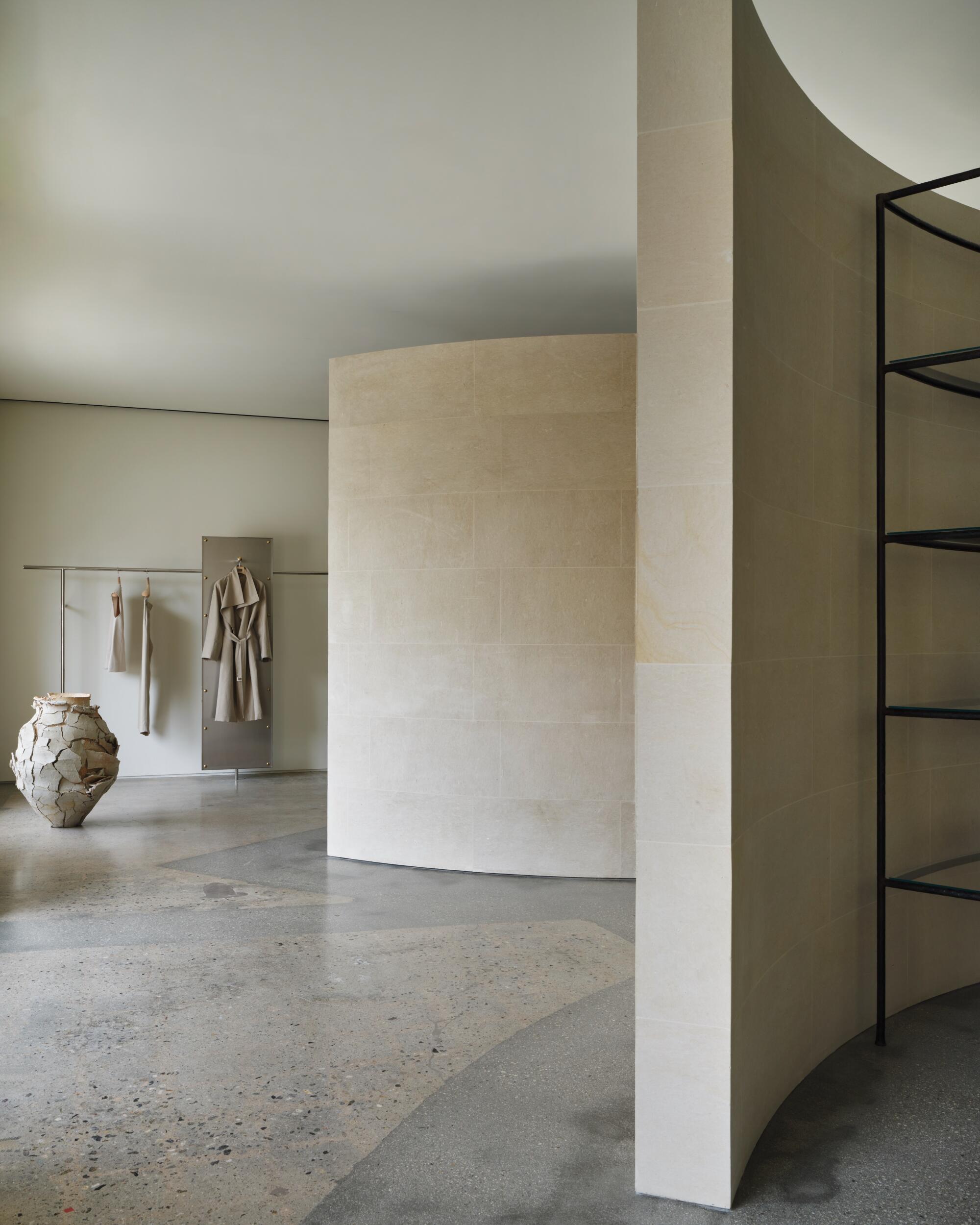 The sober white interior of a retail boutique.