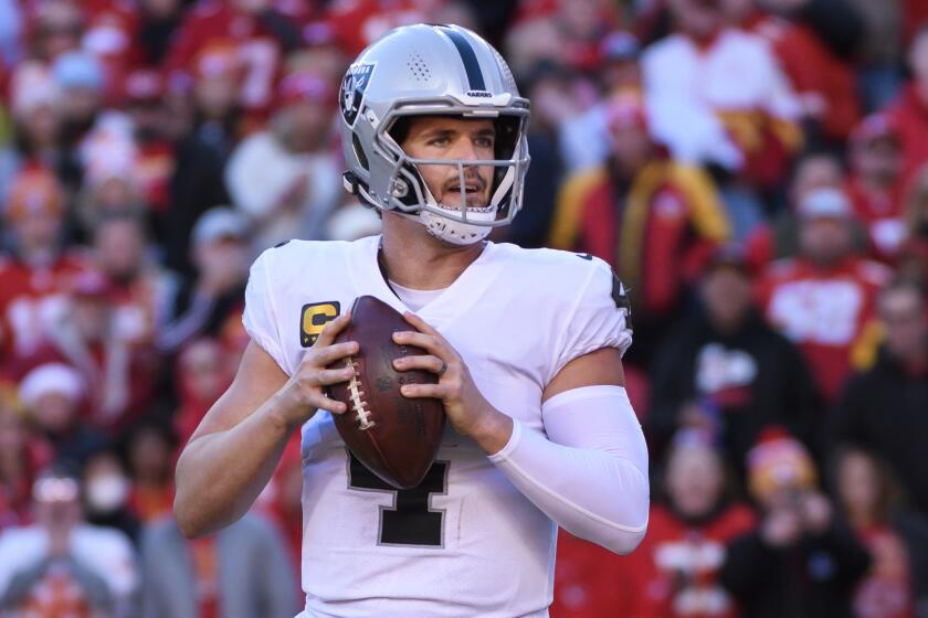 Las Vegas Raiders quarterback Derek Carr looks to throw against the Kansas City Chiefs.