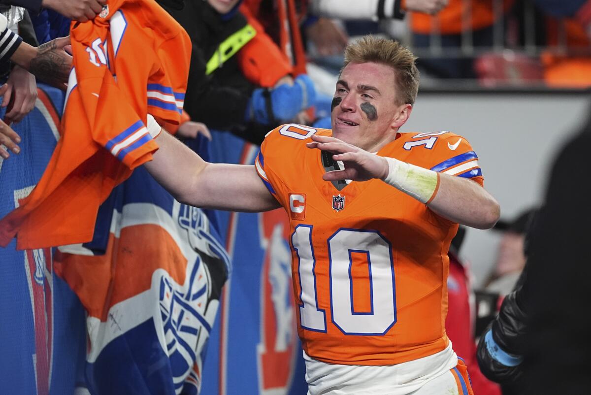 Rookie quarterback Bo Nix celebrates a blowout win over the Chiefs