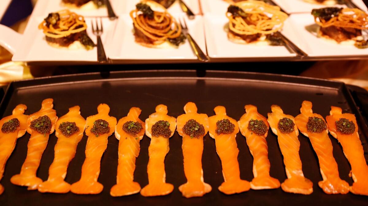 Smoked Salmon Oscar Matzo with caviar by chef Wolfgang Puck for the 89th Oscars Governors Ball press preview.