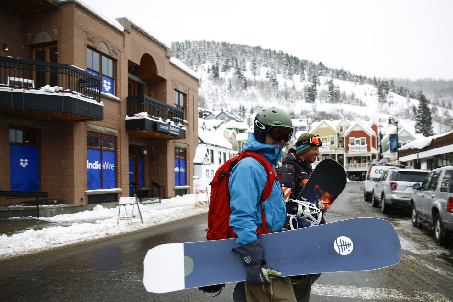 Snowboarders cross Main Street as Park City, Utah, prepares for the 2019 Sundance Film Festival on Jan. 23.